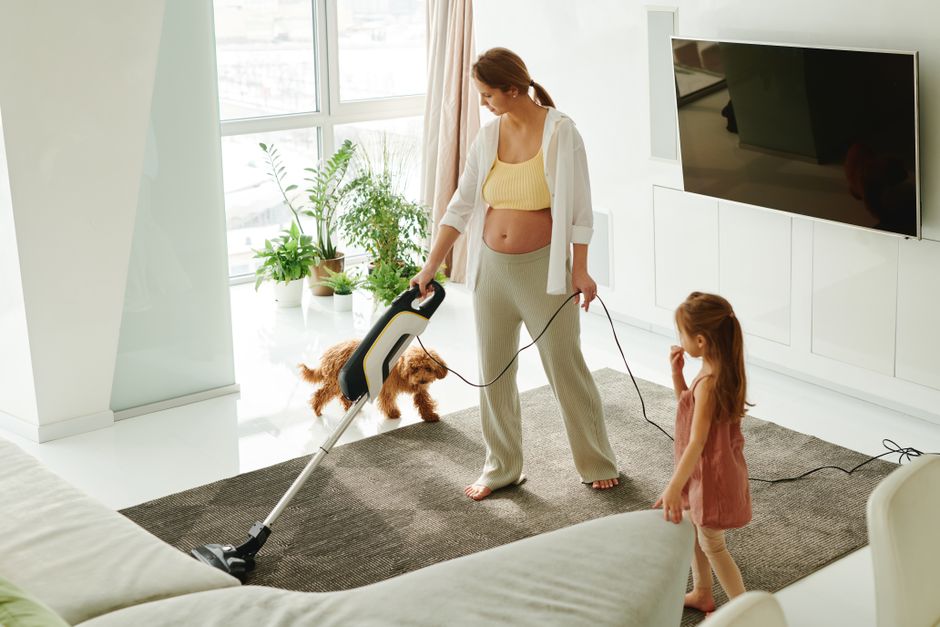 Vacuuming living room floor